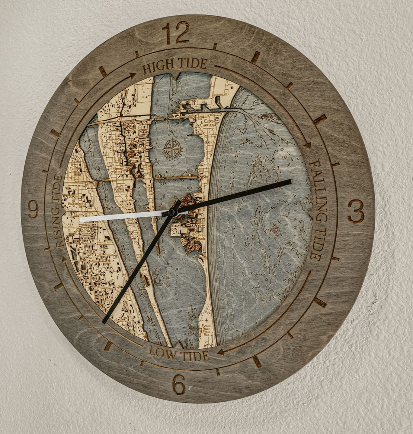 Tide clock with a carved map of the barrier island